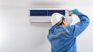 HVAC technician fixing ductless mini split AC